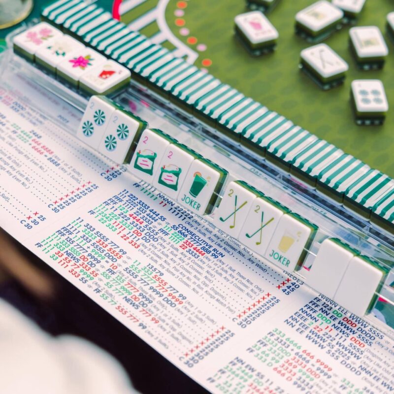 Golf-themed American mahjong tiles with green striped edges
